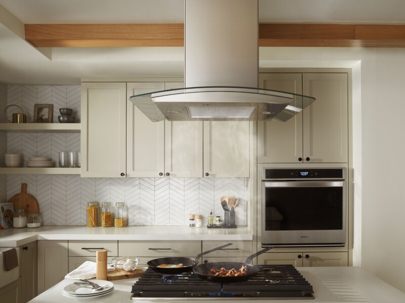 A canopy hood in a modern kitchen. A canopy hood in a modern kitchen.